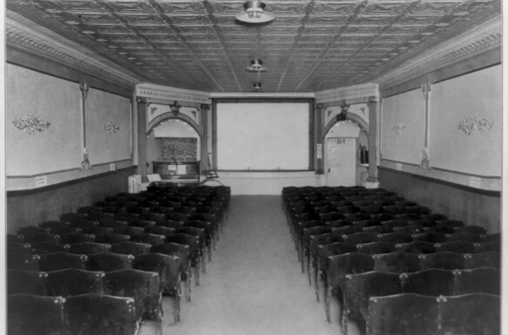 Classic cinema theatre interior with vintage seats and screen